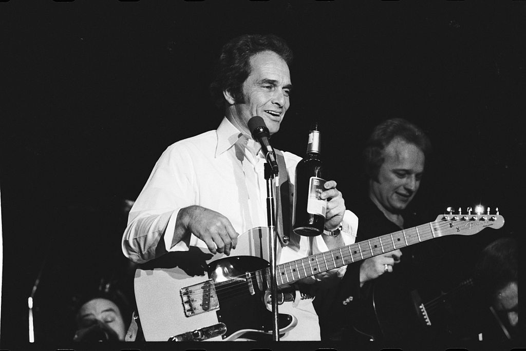 Merle Haggard Holding Bottle