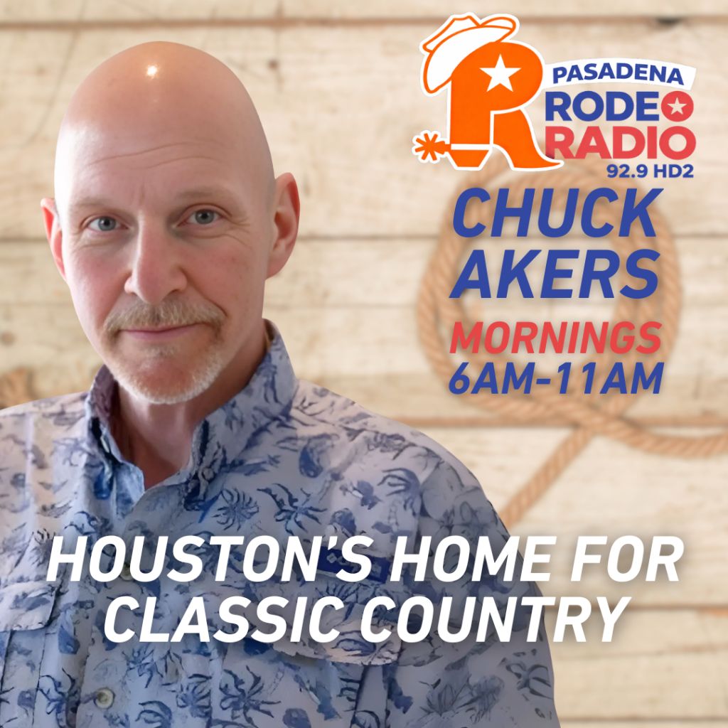 A bald man with a beard wearing a floral patterned shirt stands in front of a brick wall. The text on the wall reads "PASADENA RODEO RADIO 92.9 HD2 CHUCK AKERS MORNINGS 6AM-11AM".